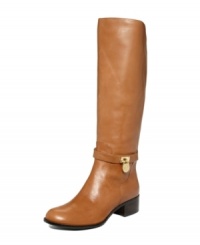 Come along for the ride--and look chic in the process!--with MICHAEL Michael Kors' timelessly elegant Hamilton tall riding boots. Crafted in leather with a low stacked heel, they feature chic logo hardware embellishment on the side. Come along for the ride--and look chic in the process!--with MICHAEL Michael Kors' timelessly elegant Hamilton tall riding boots. Crafted in leather with a low stacked heel, they feature chic logo hardware embellishment on the side.