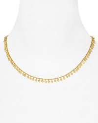 Turn up the volume on your neckline with this delicate gold necklace from Melinda Maria, trimmed in delicate gold pod beads. Turn up the volume on your neckline with this delicate gold necklace from Melinda Maria, trimmed in delicate gold pod beads.