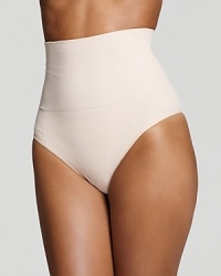 A contour thong shapewear that visibly slims and smoothes the tummy for a sleek silhouette. Style #1352 A contour thong shapewear that visibly slims and smoothes the tummy for a sleek silhouette. Style #1352