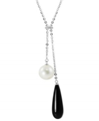 Black and white, and raved all over. This necklace, crafted from sterling silver, features both an onyx (8 mm x 25 mm) and a cultured freshwater pearl (10 mm), along with white topaz accents for a stunning look. Approximate length: 17 inches Approximate drop: 2 inches. Black and white, and raved all over. This necklace, crafted from sterling silver, features both an onyx (8 mm x 25 mm) and a cultured freshwater pearl (10 mm), along with white topaz accents for a stunning look. Approximate length: 17 inches Approximate drop: 2 inches.