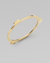 A slim bangle has an edgy, industrial look with three square tab extensions.BrassDiameter, about 3Slip-on styleImported