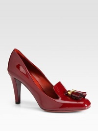 Patent leather moccasin style finished with double tassels. Self-covered heel, 3¼ (80mm)Patent leather upperLeather lining and solePadded insoleMade in Italy Patent leather moccasin style finished with double tassels. Self-covered heel, 3¼ (80mm)Patent leather upperLeather lining and solePadded insoleMade in Italy