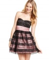 Stark color contrast and a lace-adorned tulle overlay give this party princess dress a bit of edge! From Trixxi.