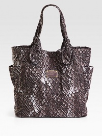 This fun, logo-stitched style provides the look of luxurious snakeskin with the durability of nylon.Double shoulder straps, 9½ dropMagnetic top closureTwo outside open pocketsOne inside zip pocketTwo inside open pocketsFully lined11¾W X 12¾H X 4¼DImported This fun, logo-stitched style provides the look of luxurious snakeskin with the durability of nylon.Double shoulder straps, 9½ dropMagnetic top closureTwo outside open pocketsOne inside zip pocketTwo inside open pocketsFully lined11¾W X 12¾H X 4¼DImported
