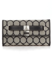 Although detailed with a classic 9 signature print, this Nine West style is a definite 10. With shiny silvertone hardware and plenty of interior compartments, this classic style will keep you chic and organized. Although detailed with a classic 9 signature print, this Nine West style is a definite 10. With shiny silvertone hardware and plenty of interior compartments, this classic style will keep you chic and organized.