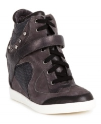 Kick your style into high gear. The Huxley wedge sneakers by GUESS feature velcro straps across the vamp and studs that line the ankle. Kick your style into high gear. The Huxley wedge sneakers by GUESS feature velcro straps across the vamp and studs that line the ankle.