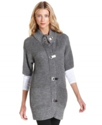 MICHAEL Michael Kors' luxe waffle-knit sweater is studded with signature logo hardware closures at the front placket. MICHAEL Michael Kors' luxe waffle-knit sweater is studded with signature logo hardware closures at the front placket.