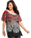 Partner your casual bottoms with Style&co.'s short sleeve plus size top, accentuated by a smocked empire waist.