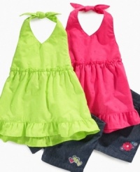 Brighten up her smile and style with this vibrant halter-top and short set from Penelope Mack. Brighten up her smile and style with this vibrant halter-top and short set from Penelope Mack.