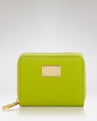 An always essential, this leather MICHAEL Michael Kors zip-around wallet is functional yet refined, crafted of pebbled leather with four card pockets. An always essential, this leather MICHAEL Michael Kors zip-around wallet is functional yet refined, crafted of pebbled leather with four card pockets.