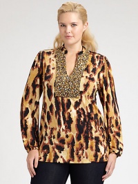 A stunning abstract animal print in an easy shape with a little stretch is richly embellished with beads and sequins at the neckline and bib for a striking, shimmering effect.Round band necklineOpen V notch, outlined in beadingLong sleeves with elasticized band cuffsBack yokeAbout 29 from shoulder to hemVenezia polyester/spandexDry cleanMade in USA A stunning abstract animal print in an easy shape with a little stretch is richly embellished with beads and sequins at the neckline and bib for a striking, shimmering effect.Round band necklineOpen V notch, outlined in beadingLong sleeves with elasticized band cuffsBack yokeAbout 29 from shoulder to hemVenezia polyester/spandexDry cleanMade in USA