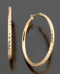 Diamond-cut 14k gold adds a fun, textured twist to these classic hoop earrings. Approximate diameter: 1-1/2 inches.