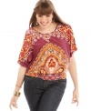 An on-trend scarf print electrifies ING's butterfly sleeve plus size top, finished by a banded hem.