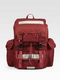 A sporty essential for the active, casual man in sleek yet durable nylon.Flap, buckle closureTop handleExterior, interior pocketsFully linedNylon11¾W x 18½H x 6¼DImported A sporty essential for the active, casual man in sleek yet durable nylon.Flap, buckle closureTop handleExterior, interior pocketsFully linedNylon11¾W x 18½H x 6¼DImported