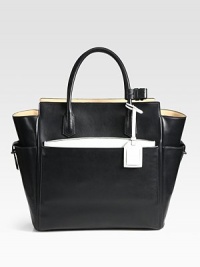 Function and luxury combine in this top-handle carryall, crafted from glovetan leather. Double top handles, 5 dropFour outside open pocketsProtective metal feetTwo inside zip pocketsInner zip pouchCotton lining18W X 13¾H X 5½DImported Function and luxury combine in this top-handle carryall, crafted from glovetan leather. Double top handles, 5 dropFour outside open pocketsProtective metal feetTwo inside zip pocketsInner zip pouchCotton lining18W X 13¾H X 5½DImported