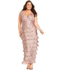 Jessica Howard's plus size evening gown shines in the spotlight with sequined cap sleeves and a shimmery finish. Jessica Howard's plus size evening gown shines in the spotlight with sequined cap sleeves and a shimmery finish.