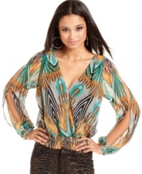 Work the party circuit in a top that has pop power! This blouson style from Baby Phat features an exotic print and sexy open-back design. Work the party circuit in a top that has pop power! This blouson style from Baby Phat features an exotic print and sexy open-back design.