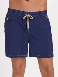 The classic Traveler swim short is rendered in sleek, quick-drying microfiber in a vibrant plaid pattern for cool, casual beach style.Elastic waistband with drawstring tie closureSide slash pocketsBack waist drainage grommetsBack flap patch pocketMesh liningInseam, about 4¾NylonMachine washImported The classic Traveler swim short is rendered in sleek, quick-drying microfiber in a vibrant plaid pattern for cool, casual beach style.Elastic waistband with drawstring tie closureSide slash pocketsBack waist drainage grommetsBack flap patch pocketMesh liningInseam, about 4¾NylonMachine washImported