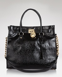 MICHAEL Michael Kors crafts an impossibly polished tote in the season's best structured shape. MICHAEL Michael Kors crafts an impossibly polished tote in the season's best structured shape.