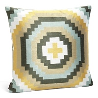 Inspired by traditional Argentine textiles, this earthy decorative pillow features an embroidered geometric pattern in shades of leaf, ice, slate, lake and moss.