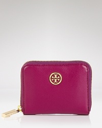 An understated logo medallion details this leather Tory Burch coin case, which features a key ring and two compartments for the small scale essentials. An understated logo medallion details this leather Tory Burch coin case, which features a key ring and two compartments for the small scale essentials.