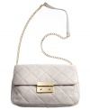 A timeless quilted design is a sophisticated classic that stays chic throughout the seasons. This large quilted shoulder bag from MICHAEL Michael Kors features polished 18K gold hardware and a posh chain detailed strap.