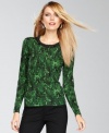 A dose of beaded shine at the neckline of this petite INC sweater puts an extra elevating spin on the snakeskin print.