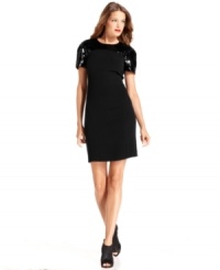 MICHAEL Michael Kors' little black dress shimmers with striking sequined detail at the shoulders. MICHAEL Michael Kors' little black dress shimmers with striking sequined detail at the shoulders.