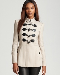 Luxe leather embellishments on this toggle-closure Burberry London jacket lend military-inspired style to the directional layering piece. Signature check lining lends an iconic touch. Luxe leather embellishments on this toggle-closure Burberry London jacket lend military-inspired style to the directional layering piece. Signature check lining lends an iconic touch.