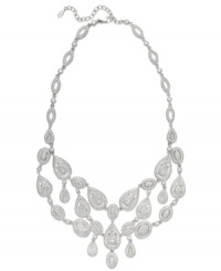The name says it all. Eliot Danori's all-around Windsor statement necklace brings high shine to any look with its stunning crystal design and rhodium-plated mixed metal setting. Approximate length: 16 inches + 2-inch extender. Approximate drop: 2 inches. The name says it all. Eliot Danori's all-around Windsor statement necklace brings high shine to any look with its stunning crystal design and rhodium-plated mixed metal setting. Approximate length: 16 inches + 2-inch extender. Approximate drop: 2 inches.