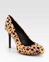 Lust-worthy pumps of soft calf hair with a daring leopard print. Stacked heel, 4 (100mm)Leopard-print calf hair upperLeather lining and solePadded insoleImported