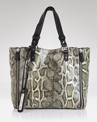 Sam Edelman's roomy tote takes on the day with an edgy textured print and industrial-strength hardware.