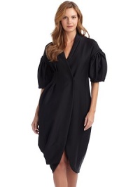 THE LOOKV necklineShort puffed sleevesConcealed double breasted snap frontPleated on one sideAsymmetrical draping at side hemSide slash pocketsTHE FITAbout 46½ from shoulder to longest point of hemTHE MATERIAL64% nylon/17% cotton/15% virgin wool/4% other fibersRayon liningCARE & ORIGINDry cleanMade in Italy THE LOOKV necklineShort puffed sleevesConcealed double breasted snap frontPleated on one sideAsymmetrical draping at side hemSide slash pocketsTHE FITAbout 46½ from shoulder to longest point of hemTHE MATERIAL64% nylon/17% cotton/15% virgin wool/4% other fibersRayon liningCARE & ORIGINDry cleanMade in Italy