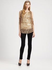 Rock the bold-shoulder trend in this sequined, silk-rich blouse with a lavish leopard print, split shoulders and airy silhouette. RoundneckSplit three-quarter sleevesLonger length hits below the hipsBody: SilkTrim: 62% viscose/35% polyethylene/3% elastaneDry cleanMade in USA of imported fabricModel shown is 5'10 (177cm) wearing US size Small.