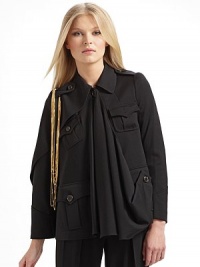An avante-garde silhouette impeccably tailored in fine Italian wool, fuses the drama of a cape and the warmth of a jacket.Asymmetrical point collar Epaulettes with dangling goldtone chains Left cape sleeve Right long sleeve Sleeves have four button cuffs Front button closure Center front drape Front button flap pockets Back flap shoulder yoke Back vented hemAbout 24 from shoulder to hem Fully lined Wool; dry clean Made in Italy An avante-garde silhouette impeccably tailored in fine Italian wool, fuses the drama of a cape and the warmth of a jacket.Asymmetrical point collar Epaulettes with dangling goldtone chains Left cape sleeve Right long sleeve Sleeves have four button cuffs Front button closure Center front drape Front button flap pockets Back flap shoulder yoke Back vented hemAbout 24 from shoulder to hem Fully lined Wool; dry clean Made in Italy