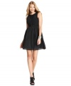 Jessica Simpson's little black dress is ready to party with its full, tulle-lined skirt and feminine features.