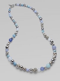 From the Elements Collection. A long-enough-to-double strand combines beads of sterling silver, blue chalcedony, aquamarine and moon quartz in an artful array of textures, sizes and shades.Blue chalcedony, aquamarine and moon quartzSterling silverLength, about 36Cable toggle claspImported