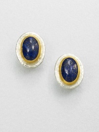 A beautiful, speckled lapis cabochon set in sterling silver and 24k gold. LapisSterling silver24k goldSize, about .9Post backImported A beautiful, speckled lapis cabochon set in sterling silver and 24k gold. LapisSterling silver24k goldSize, about .9Post backImported