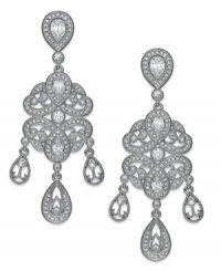 Be seen. Eliot Danori's elegant statement earrings catch light with crystal accents and cubic zirconia stones (2-1/5 ct. t.w.). Crafted in silver tone rhodium-plated mixed metal. Approximate drop: 1-3/4 inches. Be seen. Eliot Danori's elegant statement earrings catch light with crystal accents and cubic zirconia stones (2-1/5 ct. t.w.). Crafted in silver tone rhodium-plated mixed metal. Approximate drop: 1-3/4 inches.