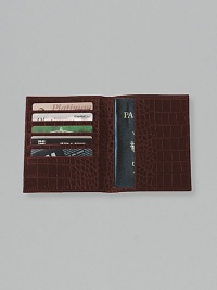 Crafted of crocodile-embossed Italian calfskin, it includes 5 credit card slots and passport compartment. 4½ X 5½ Made in USA Crafted of crocodile-embossed Italian calfskin, it includes 5 credit card slots and passport compartment. 4½ X 5½ Made in USA