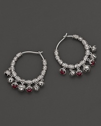 Inspired by Zen philosophy, these hoop earrings from Paul Morelli feature intricately detailed sterling silver meditation bells, set with pink rhodolite cabochons. Inspired by Zen philosophy, these hoop earrings from Paul Morelli feature intricately detailed sterling silver meditation bells, set with pink rhodolite cabochons.