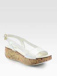 Patent leather silhouette with a natural cork wedge and adjustable slingback strap. Cork wedge, 1¾ (45mm)Cork platform, 1 (25mm)Compares to a ¾ heel (20mm)Patent leather upperLeather lining and soleMade in ItalyOUR FIT MODEL RECOMMENDS ordering true size. Patent leather silhouette with a natural cork wedge and adjustable slingback strap. Cork wedge, 1¾ (45mm)Cork platform, 1 (25mm)Compares to a ¾ heel (20mm)Patent leather upperLeather lining and soleMade in ItalyOUR FIT MODEL RECOMMENDS ordering true size.