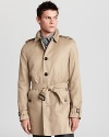 A single breasted silhouette lends a clean, timeless look to a classic Burberry trench.