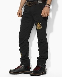 A classic cargo in cotton chino exudes sporty regality with a Snow Polo Challenge crest and applied IV at the legs. A classic cargo in cotton chino exudes sporty regality with a Snow Polo Challenge crest and applied IV at the legs.