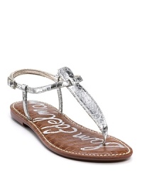 Look fabulous poolside in these metallic snake printed t-strap sandals.