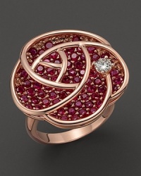 Set in 14K rose gold, this pink sapphire blossom is dewed with a diamond. Set in 14K rose gold, this pink sapphire blossom is dewed with a diamond.