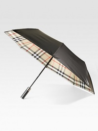 This walking umbrella offers a shiny-sleek look and ample coverage from the elements.Automatic openOpen diameter, about 47Folded length, about 37PolyesterImported This walking umbrella offers a shiny-sleek look and ample coverage from the elements.Automatic openOpen diameter, about 47Folded length, about 37PolyesterImported