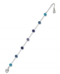 Saturated shades of blue, turquoise and purple complement one another beautifully on Swarovski's Pointiage bracelet. Set in silver tone mixed metal, it features a stylish series of spherical shapes. Approximate length: 6-1/2 inches. Saturated shades of blue, turquoise and purple complement one another beautifully on Swarovski's Pointiage bracelet. Set in silver tone mixed metal, it features a stylish series of spherical shapes. Approximate length: 6-1/2 inches.