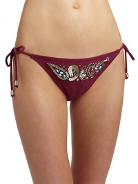 THE LOOKElastic waist and leg openingsFront band of beads and sequins in an ornate paisley patternSide tiesTHE MATERIAL80% nylon/20% spandexFully linedCARE & ORIGINHand washImportedPlease note: Bikini top sold separately. THE LOOKElastic waist and leg openingsFront band of beads and sequins in an ornate paisley patternSide tiesTHE MATERIAL80% nylon/20% spandexFully linedCARE & ORIGINHand washImportedPlease note: Bikini top sold separately.