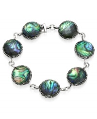 Inspire your look with ocean color. Genevieve & Grace's pretty link bracelet features round-cut abalone glass and glittering marcasite. Set in sterling silver. Approximate length: 7 inches. Inspire your look with ocean color. Genevieve & Grace's pretty link bracelet features round-cut abalone glass and glittering marcasite. Set in sterling silver. Approximate length: 7 inches.